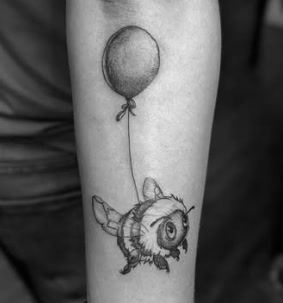 Black and grey bee with balloon tattoo
